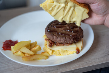 Handmade hamburger with french fries and dips made at home
