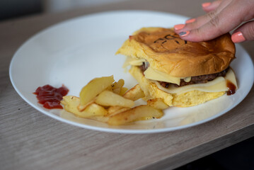 Handmade hamburger with french fries and dips made at home