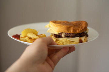 Handmade hamburger with french fries and dips made at home