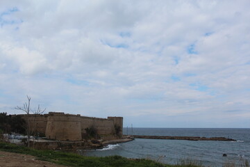 Fototapeta na wymiar Kyrenia Castle shores and breakwater, Cyprus