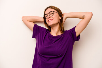 Fototapeta premium Young caucasian woman isolated on white background feeling confident, with hands behind the head.