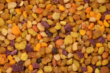 close-up of pollen, grainy texture, bright not uniform color