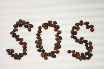 Sign S.O.S. with coffee bean