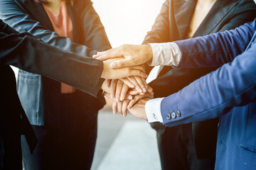 Close the perspective of young businessmen put their hands together, piles of hands, unity and...