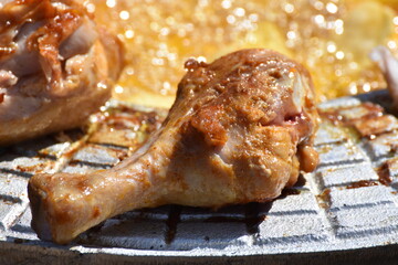 crispy chicken and fried potatoes on a cast iron disk