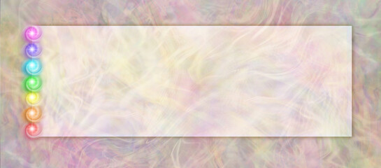 Seven Chakra Stack Message Banner - warm coloured wispy ethereal background with a darker edge frame and shadow line with a rainbow coloured stack of chakra vortex spirals and copy space for messages
