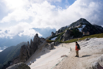 Naklejka premium A lone hiker on the Peak of Mount Tsubakuro, Nagano, Japan.