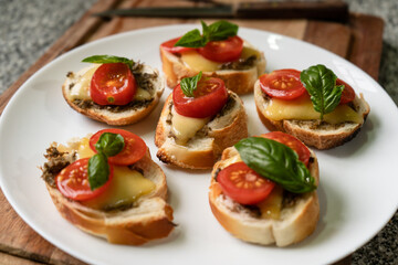 Mediterranean toasts with tomato cheese and basil