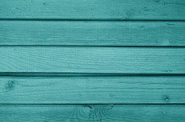 Obraz premium Old grungy wooden planks background in cyan color.