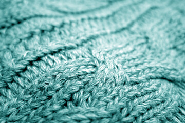 Warm knitting texture with blur effect in cyan tone.
