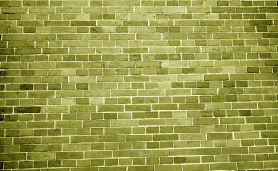 Pattern of brick wall in yellow tone.