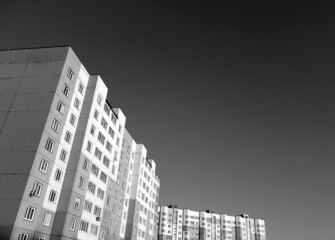 Block of flats, cheap residential building. Black and white