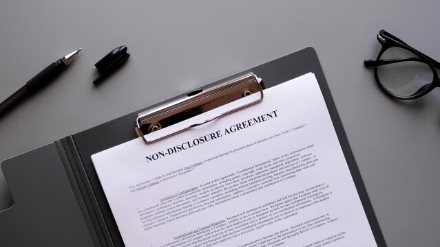Opening folder with NDA document. Non-disclosure agreement. 4K footage