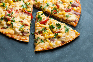 delicious pizza close up. carbonara with fresh vegetables. large pie with vegetable filling. fast food concept