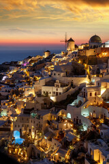 Impressive evening view of Santorini island. Picturesque sunset on the famous Greek resort Oia,...