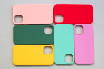 Cases set for smartphone on grey background. Silicone protection for mobile phone. Colorful...