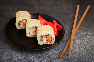 Sushi rolls with shrimp and sesame, Japanese cuisine, shallow depth of field