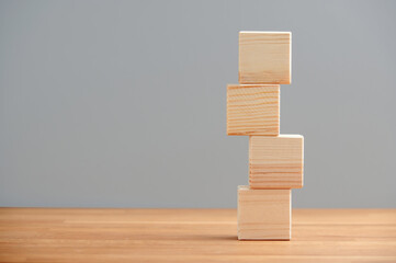 Blank wooden block cubes on a gray background for your text and advertisement. Free space for business concept template and banner..