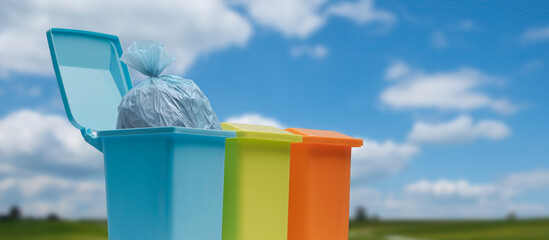 Colorful recycling bins and blue sky