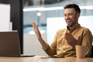 Entrepreneur Laughing Having Video Call Talking To Laptop In Office