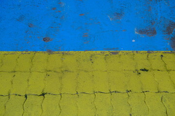 The ground of the parking painted in blue and yellow.