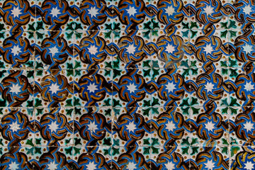 Traditional tiled wall decoration in a city palace in Seville, Spain.