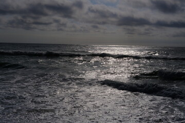 A wave and some reflections on the ocean. Cap Ferret, France.