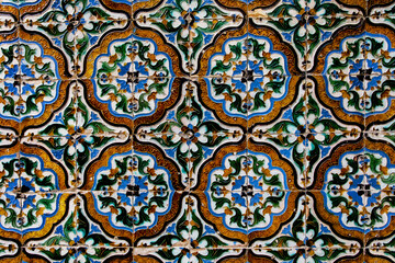 Traditional tiled wall decoration in a city palace in Seville, Spain.