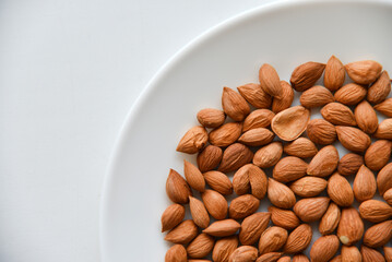 Apricot kernel nuts on a white plate