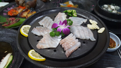 Raw fish or Sashimi on a fancy plate