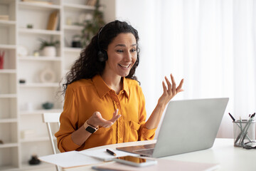 Cheerful Lady Talking Wearing Headset Making Video Call In Office