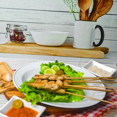 Taichan satay is a traditional food from Jakarta consisting of grilled chicken satay without soy sauce and peanut sauce