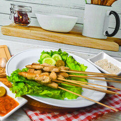 Taichan satay is a traditional food from Jakarta consisting of grilled chicken satay without soy sauce and peanut sauce