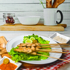 Taichan satay is a traditional food from Jakarta consisting of grilled chicken satay without soy sauce and peanut sauce