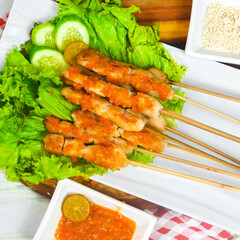 Taichan satay is a traditional food from Jakarta consisting of grilled chicken satay without soy sauce and peanut sauce