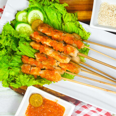 Taichan satay is a traditional food from Jakarta consisting of grilled chicken satay without soy sauce and peanut sauce