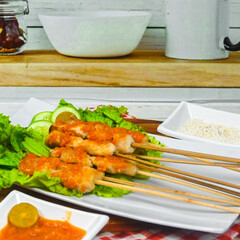 Taichan satay is a traditional food from Jakarta consisting of grilled chicken satay without soy sauce and peanut sauce