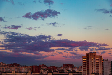 Beautiful colorful sunset sky over the city.