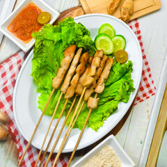 Taichan satay is a traditional food from Jakarta consisting of grilled chicken satay without soy sauce and peanut sauce