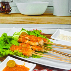Taichan satay is a traditional food from Jakarta consisting of grilled chicken satay without soy sauce and peanut sauce