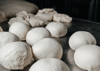 Fototapeta na wymiar Dough balls for baking and pizza