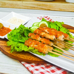 Taichan satay is a traditional food from Jakarta consisting of grilled chicken satay without soy sauce and peanut sauce