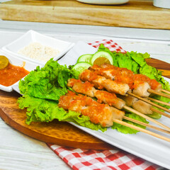 Taichan satay is a traditional food from Jakarta consisting of grilled chicken satay without soy sauce and peanut sauce