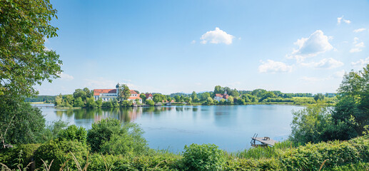 Fototapeta premium view to lake Seeon and cloister from circular walkway. landscape in bavaria