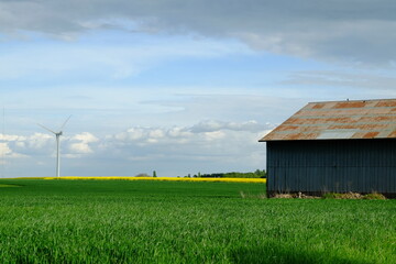 A warehouse and some fields in the countryside. April 2022, Yvelines, France.