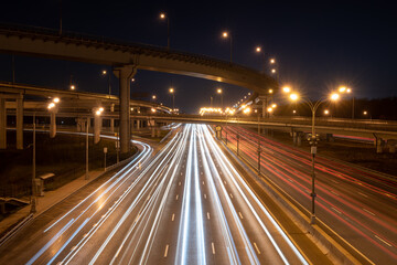 Fototapeta na wymiar Long exposure light trails on a modern speedway