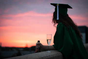Graduate Celebrating at Sunset