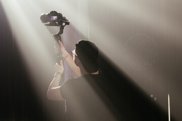 Cameraman silhouette. Professional cameraman - covering on event with a video, cameraman silhouette...