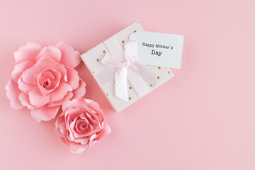 Paper roses with gift box and Mother's Day card. Copy space.