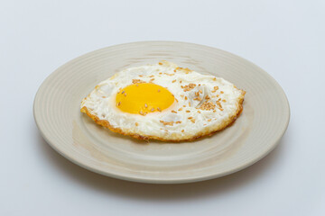 Half-boiled fried egg in a bowl